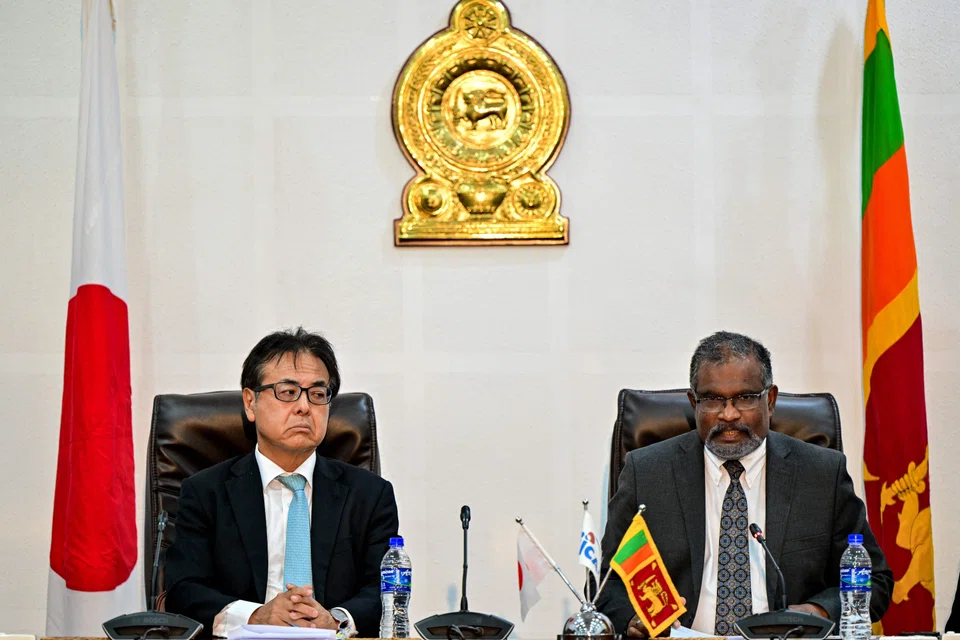 Japan's ambassador to Sri Lanka Hideaki Mizukoshi (L) and Secretary to Sri Lanka's finance ministry Mahinda Siriwardana address a joint press conference in Colombo. “Japan is the first country to resume financing for the suspended projects,” Hideaki told reporters.