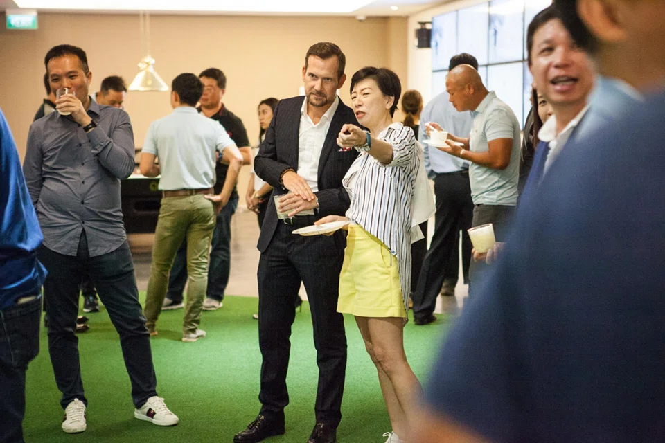 Audi Singapore managing director Markus Schuster (in jacket) at the same event which was held at Singapore Pools’ Livewire branch at China Square. 