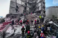 First responders in Beirut search for missing people at a residential building hit by an Israeli air strike on Wednesday (Apr 8). 