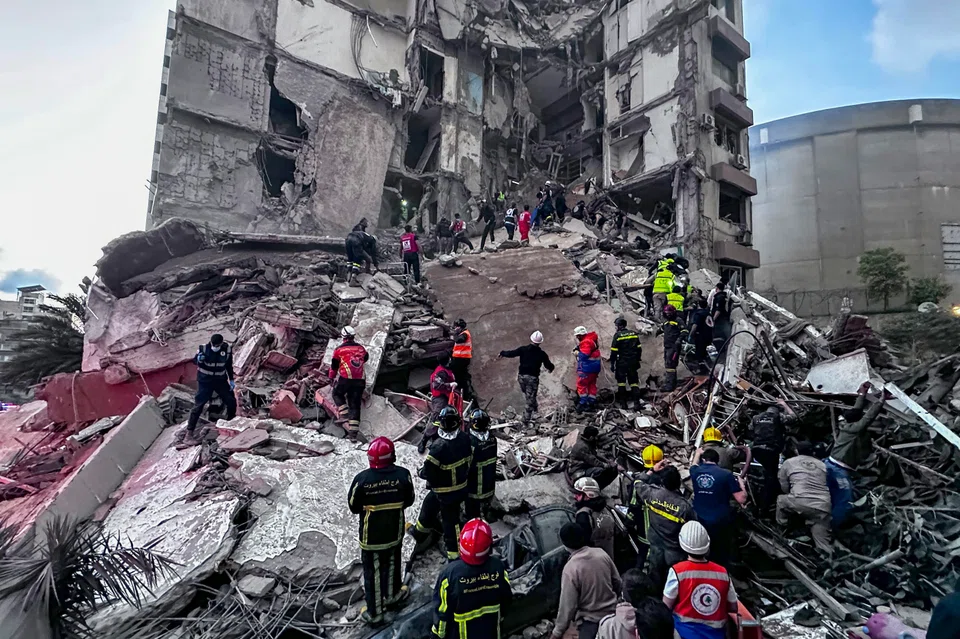 First responders in Beirut search for missing people at a residential building hit by an Israeli air strike on Wednesday (Apr 8). 