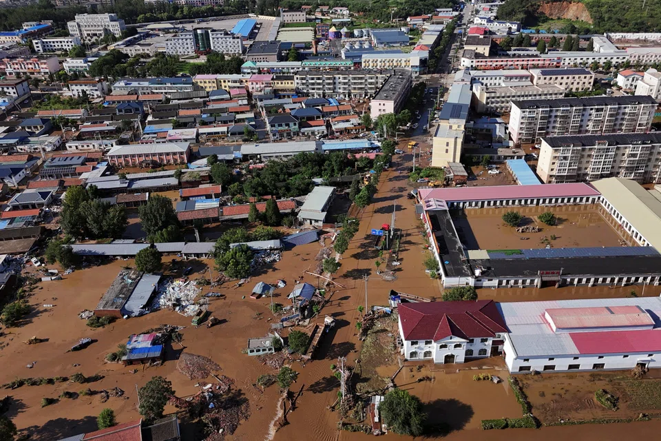 Partially submerged buildings after heavy rainfall flooded Miyun district, Beijing, China, July 29, 2025.