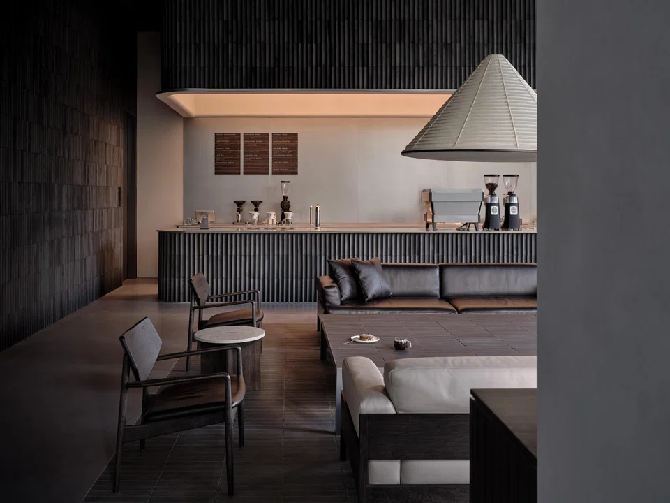 Blue Bottle Coffee Jing’an Kerry Center in Shanghai featuring traditional roof tiles.