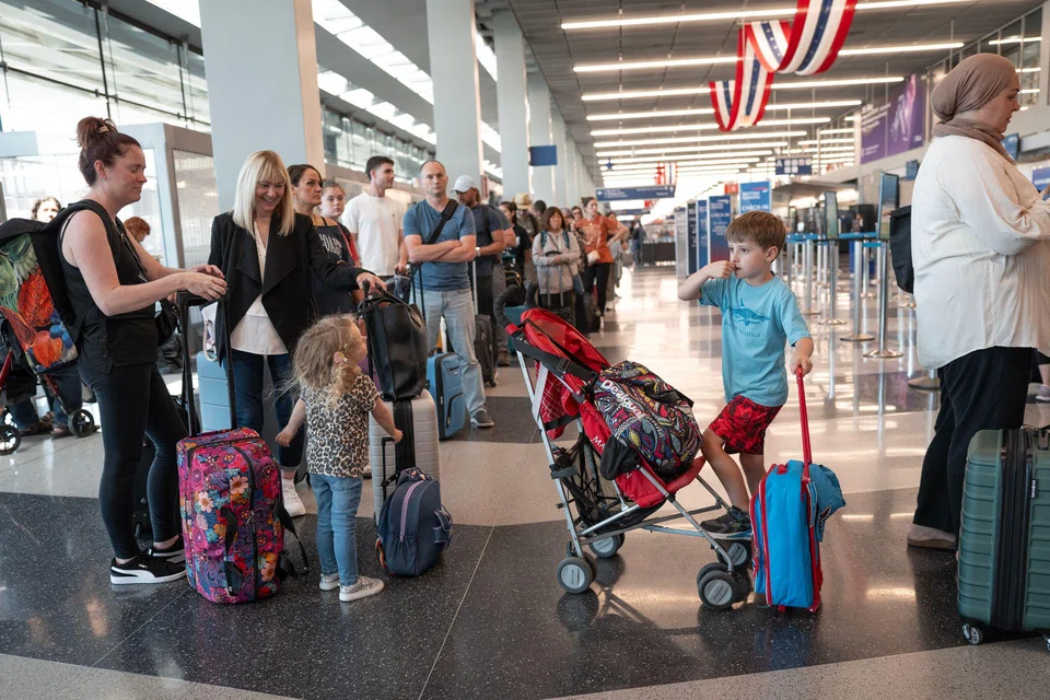 Passengers wait in line to check in for flights at O'Hare airport, Chicago, Illinois, July 3, 2024. With an estimated 71 million Americans leaving home for the holiday, TSA predicts it could be one of the busiest travel periods ever at the nation’s airports.   