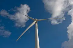 The state-run energy utility will buy electricity at US$0.0826 a kilowatt-hour from a US$442-million wind power plant the Indian conglomerate is building in the island nation. 