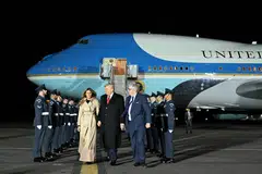 US President Donald Trump (centre) and US First Lady Melania Trump disembark from Air Force One after landing at Stansted Airport, Britain, on the first day of a two-day visit, Sep 16, 2025.