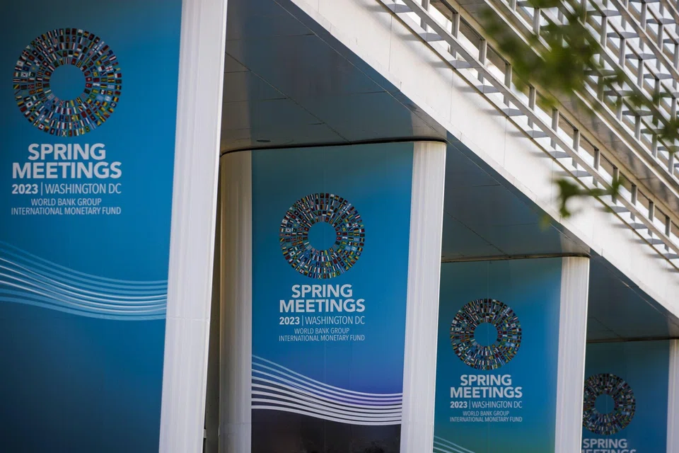 International Monetary Fund and World Bank spring meetings signs outside the IMF headquarters in Washington, DC, US, on April 11, 2023. 