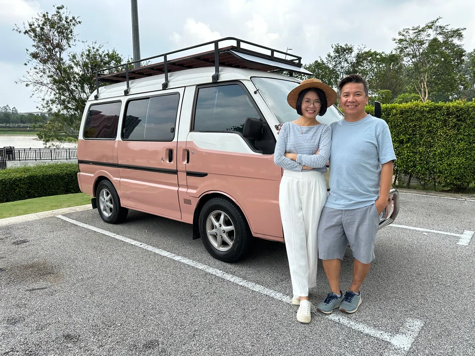 Yap Yoong Ching and her husband Alvin Low, with her pink campervan.