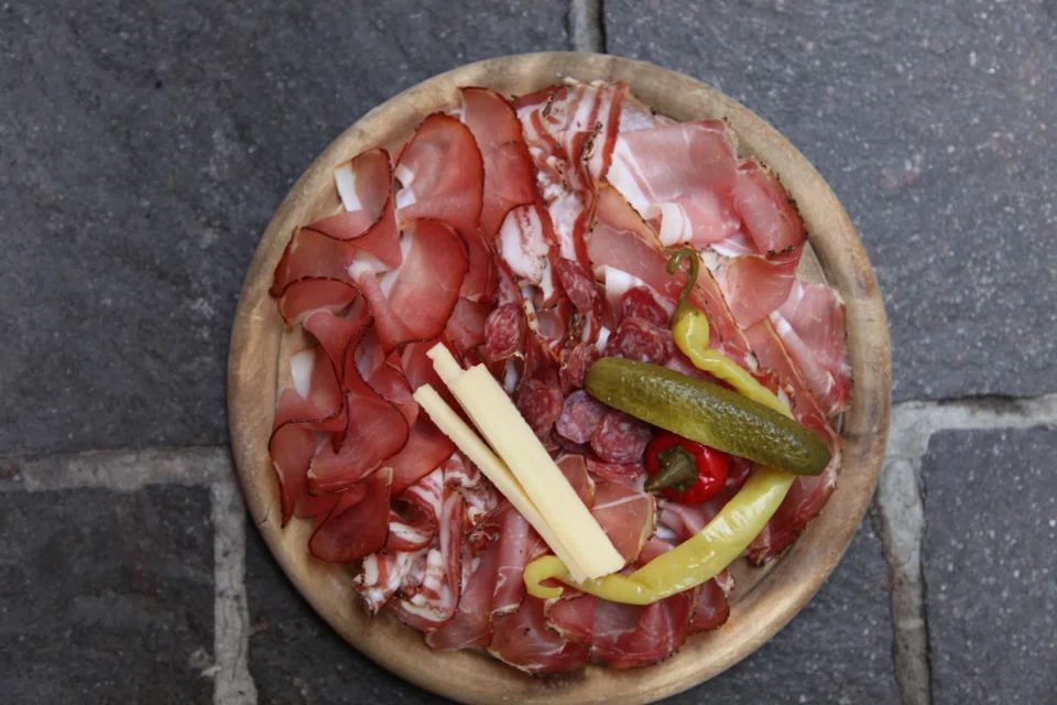 Enjoy a platter of speck or bacon at small eateries like Speckeria