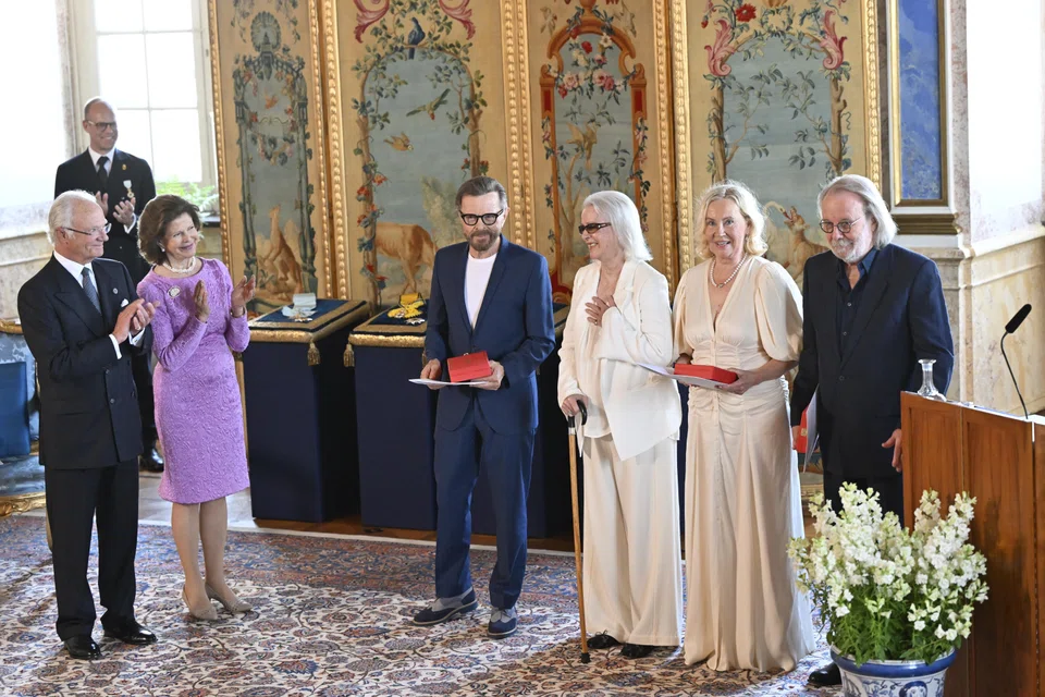 The music group ABBA with Björn Ulvaeus, Anni-Frid Lyngstad, Agnetha Fältskog and Benny Andersson receive the Royal Vasa Order from Sweden's King Carl XVI Gustaf (left) and Queen Silvia (second from left) for outstanding contributions to Swedish and international music life during a ceremony at Stockholm's  Royal Palace in Stockholm, Sweden.