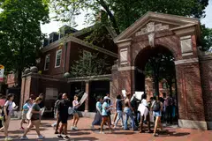 Affirmative action supporters walk through a gate at Harvard University on July 1, 2023, the day after the US Supreme Court ruled that race-conscious admissions programmes at Harvard and the University of North Carolina were unconstitutional. 