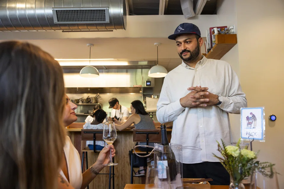 Arjav Ezekiel greets diners at Birdie's, his restaurant in Austin, Texas on Aug 6, 2024. 