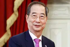 Prime Minister Han Duck-soo (above) will step in to perform presidential duties if the President Yoon quits or is removed from office.