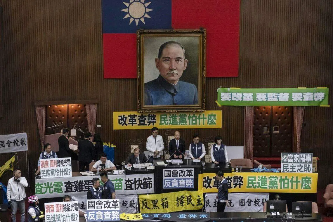 Inside parliament, lawmakers chanted slogans and plastered the chamber with banners, occasionally scuffling, with debate going on late into the evening.
