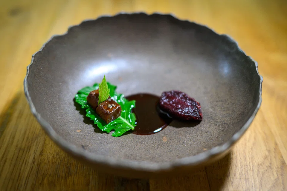 Hisa Franko's starter of deer heart, oyster, kiwi and beetroot with mountain greens.