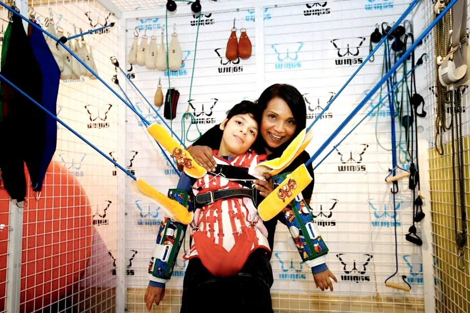 Judith Julia Justin with her son, Jake, during therapy at Wings.