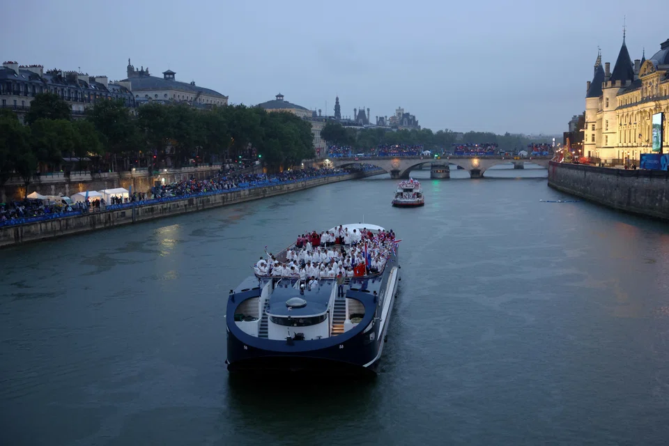 Team Netherlands and Team Peru are seen on a boat along the River Seine  during the opening ceremony of the Olympic Games Paris 2024, Paris, France, July 26, 2024.   