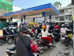 Motorists line up to refuel at a gas station in Hanoi on Mar 10.