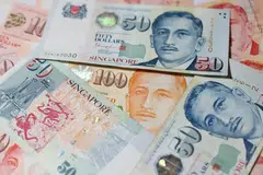 The Singdollar remains firm within its policy band, though low interest rates could weigh on it, analysts said.