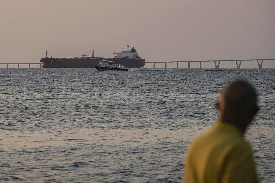 An oil tanker is seen from the Lake Maracaibo boardwalk in Maracaibo, Venezuela, Dec 17, 2025. The US is in pursuit of an oil tanker flying under a false flag in Venezuela. 