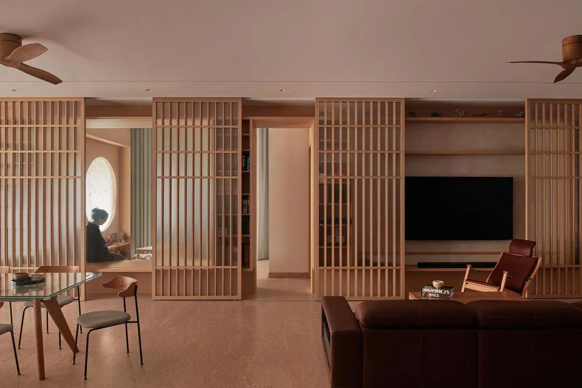 Sliding screens hide the television when it is not in use. 