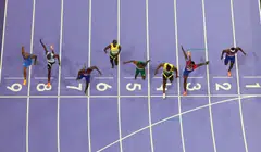 In a stunning photo finish, American Noah Lyles (in lane seven) crosses the line first, by 0.005 seconds, to win gold in the 100 m race ahead of Jamaica's Kishane Thompson (in lane four).