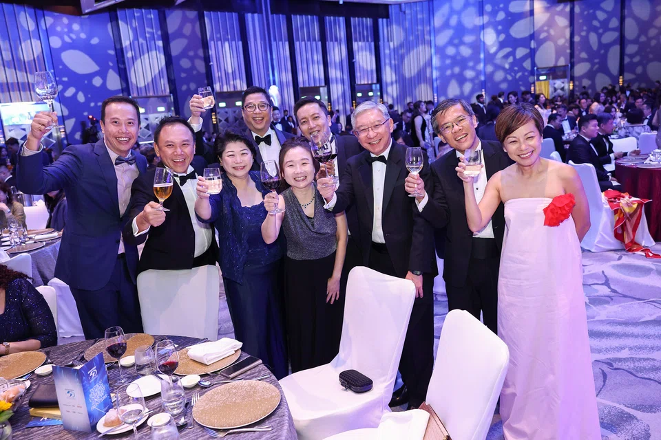 Cheers! (From left): Mark Lee, director, TS Group; Melvin Tan, council member of E50 Association; Susan Chong, immediate past president, E50 Association; Brandon Lim, director, private enterprise, KPMG in Singapore; Chen Huifen, editor, The Business Times; Chiu Wu Hong, partner, head of private enterprise, KPMG in Singapore; Linus Goh, head, global commercial banking, OCBC; Kok Ping Soon, CEO, Singapore Business Federation; and Lee Sze Yeng, managing partner, KPMG in Singapore. 