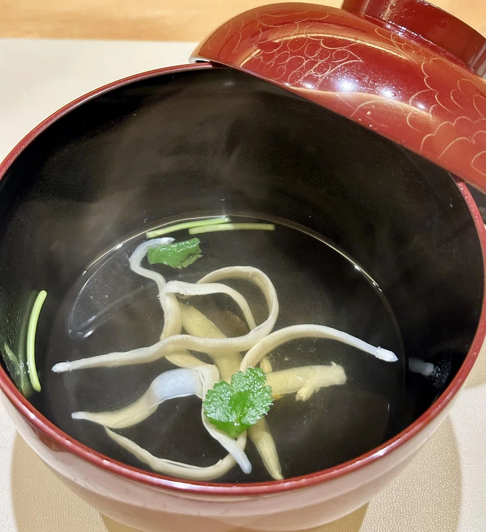 Clear dashi with slippery baby eels.