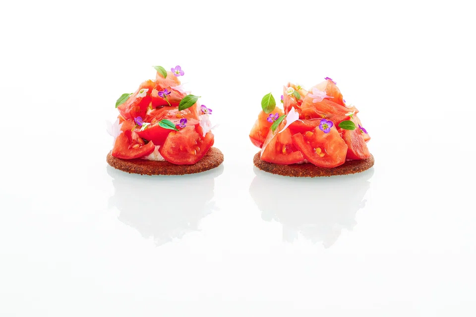 Crisp parmesan tarts topped with sweet-sour Japanese tomatoes.