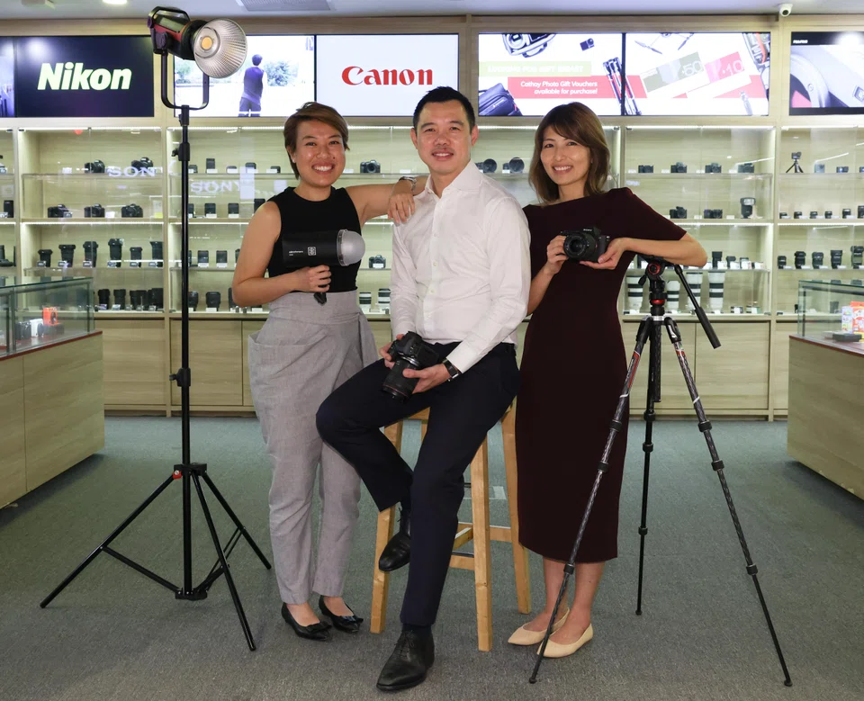 From left: Jill Koh, Ryan Toh and Charmaine Toh are the third-generation owners of Cathay Photo. 