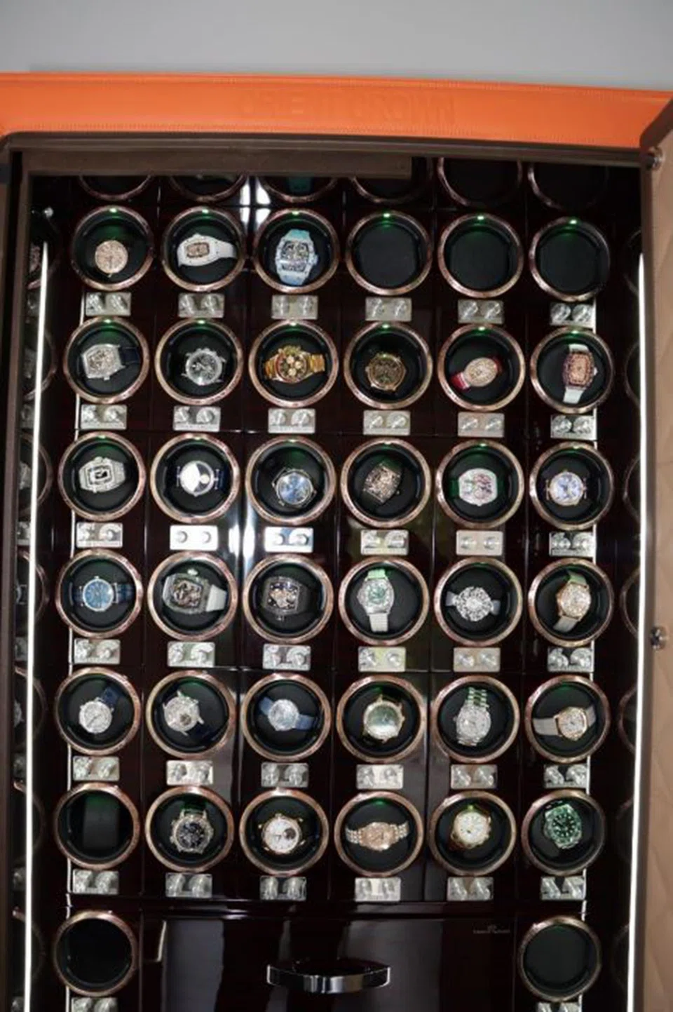 Some of the assets seized in the billion-dollar anti-money laundering raid on Aug 15 include cash, high-end watches and bags.