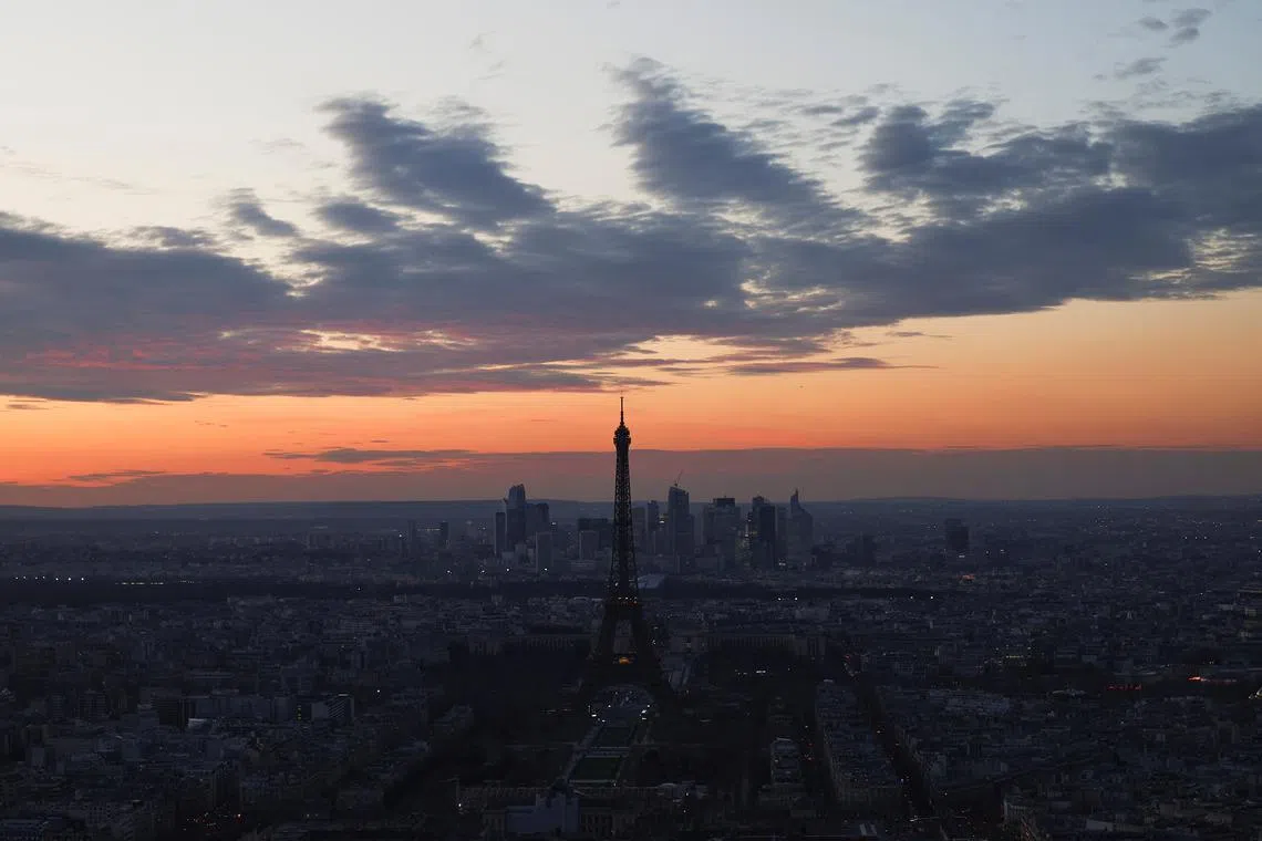 General view of the Eiffel Tower and the Paris skyline at sunset from the Montparnasse Tower in Paris, France, March 19, 2025. REUTERS/Abdul Saboor