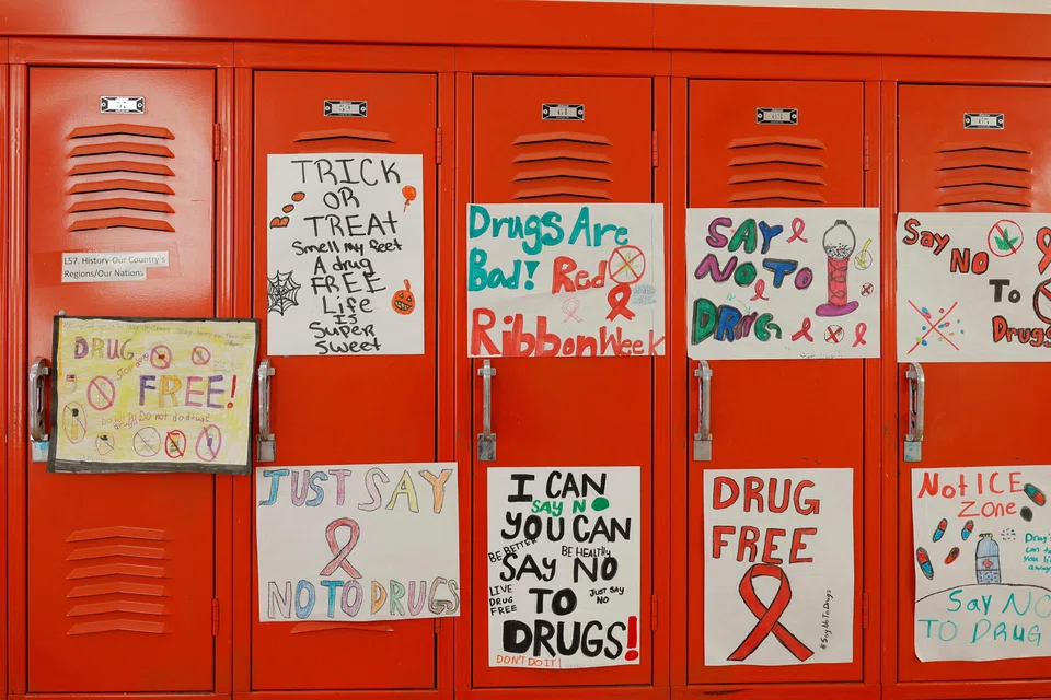 Hand-drawn signs in a school in the US. A serious drive to counter drug abuse needs to prioritise tackling demand.