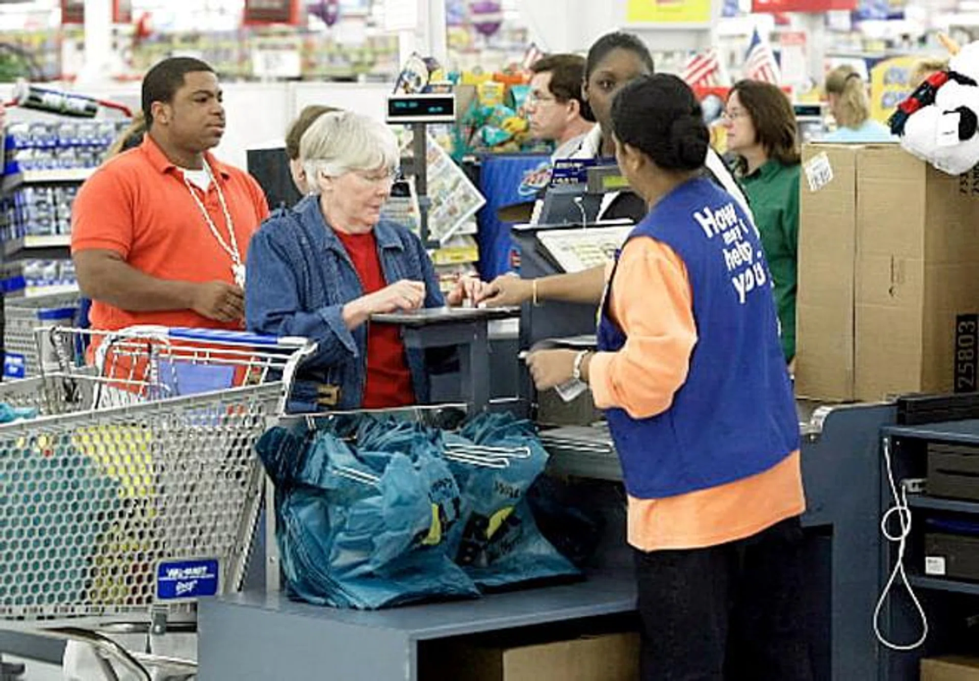 US service sector expands at a slower pace, hiring picks up