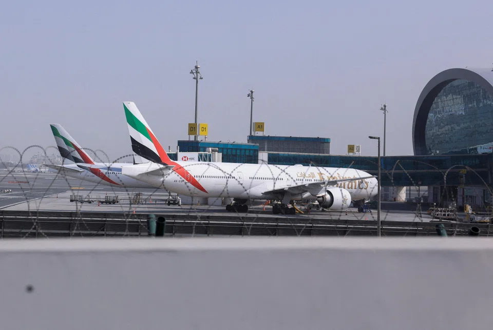 Planes parked at Terminal 3 of the Dubai International Airport, following the United States and Israel strikes on Iran, in Dubai, United Arab Emirates, March 2, 2026.