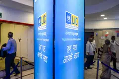 State-run insurer Life Insurance Corporation of India dropped early in its Mumbai trading debut after a record initial public offering that priced at the top of the range and was oversubscribed nearly 3 times. 