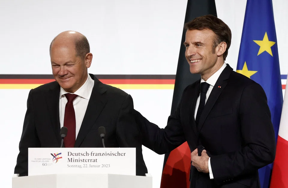 French President Emmanuel Macron and German Chancellor Olaf Scholz at a news conference as part of a Franco-German joint Cabinet meeting, during the celebration of the 60th anniversary of the signing of the Elysee Treaty, at the Elysee Palace in Paris, France, Jan 22, 2023.  