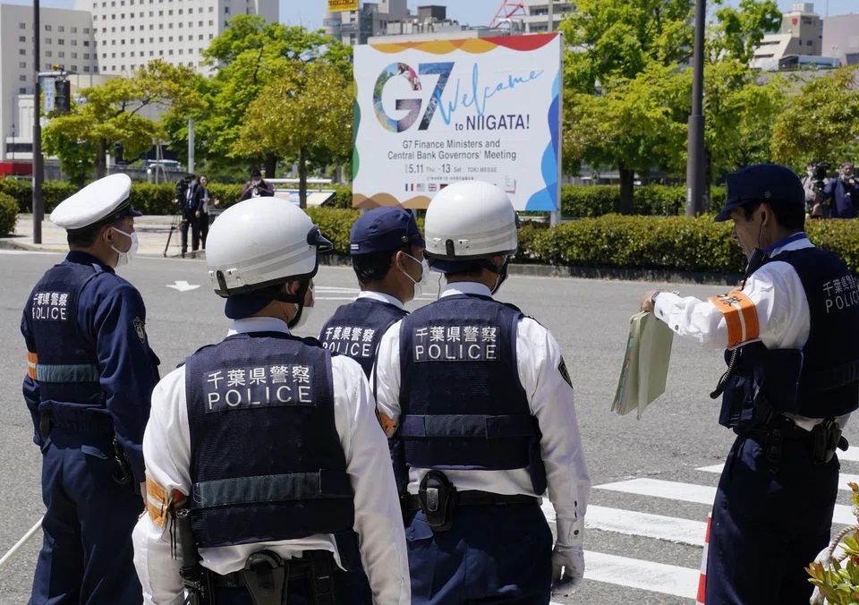 Police officers prepare for security checks outside the venue of the G7 Finance Ministers and Central Bank Governors' meeting in Niigata, northern Japan, May 11, 2023. 