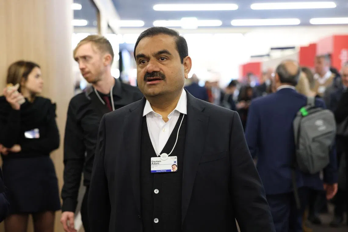 Adani (top), his nephew Sagar Adani, and another Adani Group executive were charged with securities fraud and conspiracy.
