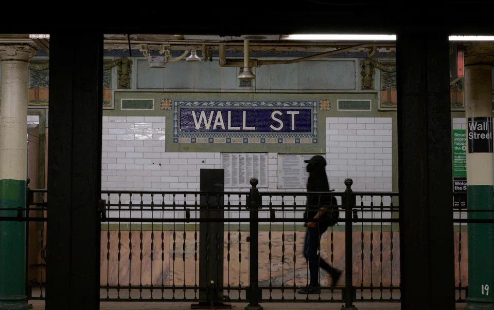 A person walks through the Wall Street subway station near the New York Stock Exchange. On Jun 15 at the end of the central bank’s 2-day policy meeting, Fed chairman Jerome Powell’s rate-setting committee boosted interest rates by three-quarters of a percentage point, the largest hike since 1994.