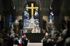 Laurent Ulrich, the archbishop of Paris, leading prayers for the consecration of the main altar, designed by French artist and designer Guillaume Bardet which replaces the old one that was destroyed in 2019, during a mass at the Notre-Dame cathedral on Dec 8. 