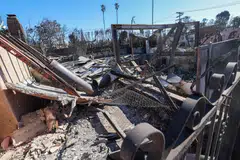 The fires that killed at least 24 people also destroyed more than 12,000 structures, many of them homes. 