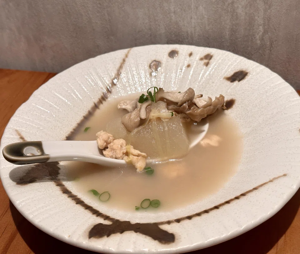 A hearty chicken-soybean broth is comforting and richly flavoured.