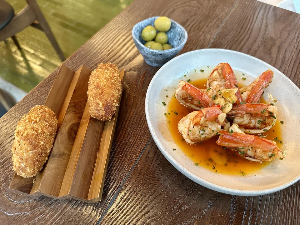 Crunchy croquetas and prawns cooked in chilli garlic oil.