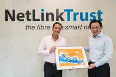 Tan Kiat How (left), senior minister of state for digital development and information, officiated the opening of the Seletar Central Office. With him is Chaly Mah, chairman of NetLink NBN Trust.