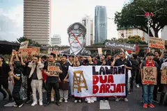 Protesters march demonstrating against MACC chief commissioner Azam Baki in Kuala Lumpur. A report says he has shareholdings higher than allowed limits for public officials. 