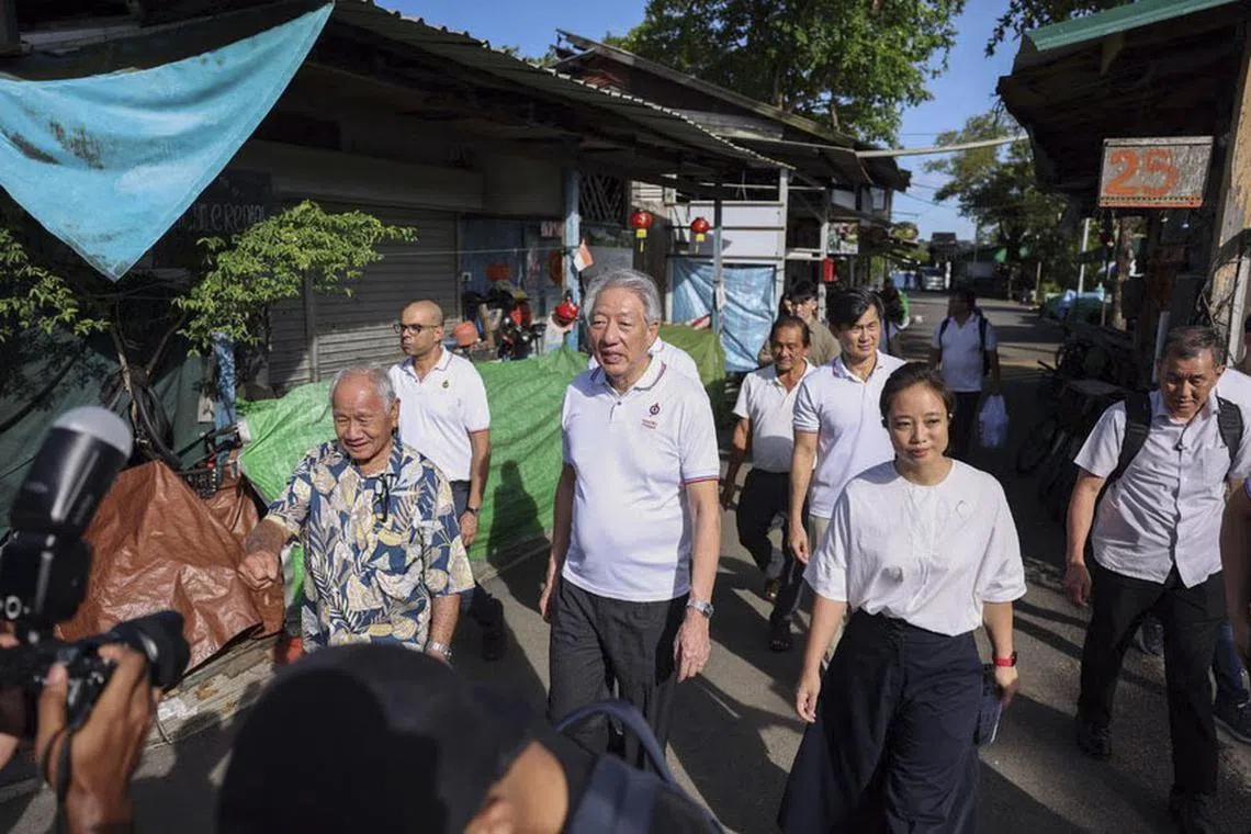 Senior Minister Teo Chee Hean (foreground, centre) leading a PAP team comprising party newcomer Valerie Lee, Senior Minister of State in the Prime Minister’s Office Desmond Tan (behind Ms Lee), Senior Minister of State (Digital Development and Information and Health) Janil Puthucheary and Pasir Ris-Punggol GRC MP Sharael Taha (behind SM Teo, partially hidden) during a visit to Pulau Ubin on Apr 11.