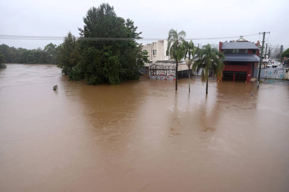 Floodwaters reach the levee walls holding back the Wilsons River in Lismore, Australia, March 8, 2025. 