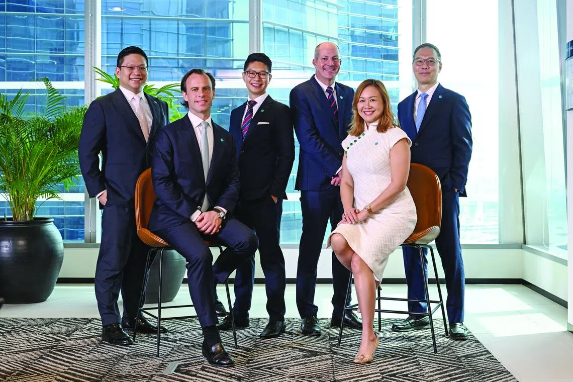 From left (back row): Ken Sze, Head of Investments Asia; Ong Shun Wei, Head of Discretionary Portfolio Management; David Ratcliffe, Chief Operating Officer; Wengmun Loh, Head of Dealing. From left (front row): Tom Road, Team Lead, International; Evonne Tan, Head of Private Bank.