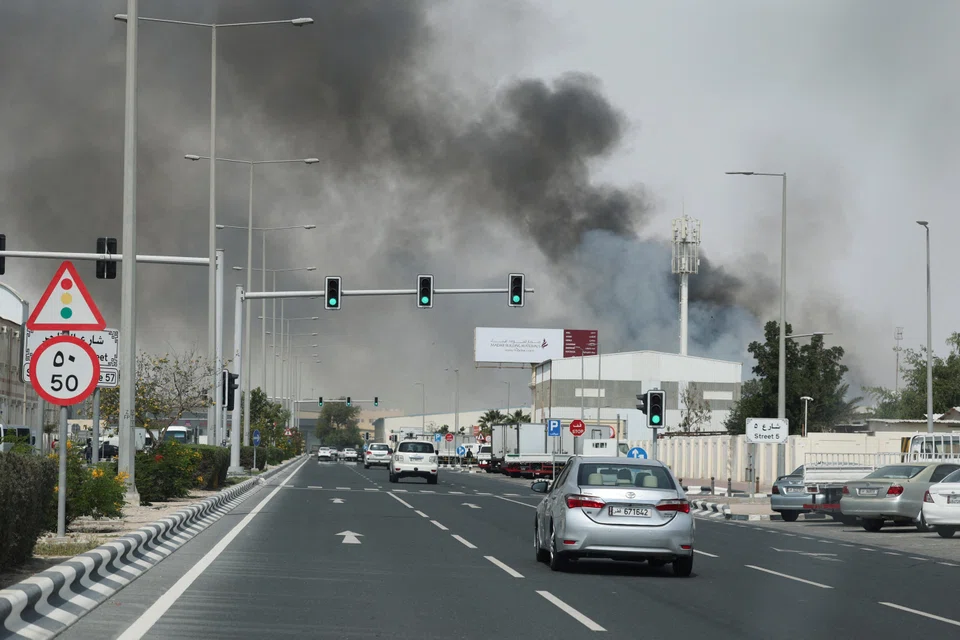 Smoke rising in Doha on Mar 1 after Iranian missile attacks. Airports, embassies, ports and hotels in several US-allied Gulf states have been struck by Teheran in retaliation.