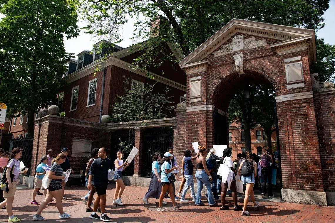 Affirmative action supporters walk through a gate at Harvard University on July 1, 2023, the day after the US Supreme Court ruled that race-conscious admissions programmes at Harvard and the University of North Carolina were unconstitutional. 